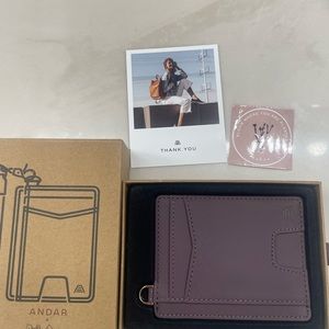 Andar Denner plum wallet.  New/never used.